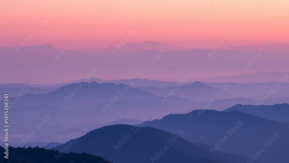 Fototapeta premium Layered mountain ranges under a pink and purple sky at dusk creating a serene and peaceful landscape view