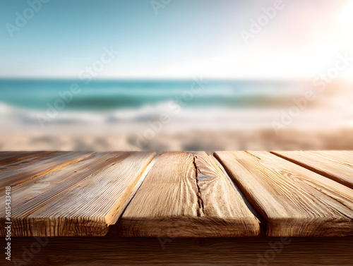 
A sunlit wooden table by the beach with blurred ocean background