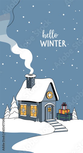 Cozy winter scene with a snow covered house and warm lights emitting from the windows and a chimney puffing smoke into the cold air