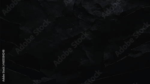 Dark textured black granite surface with veins and light reflections