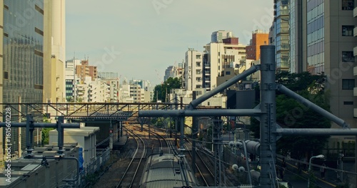 Photography Railway in the city. The train is moving along the rails