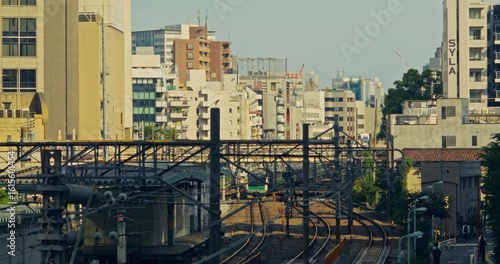 Wallpaper Mural View from the bridge to the railway in the city. The train is moving along the rails Torontodigital.ca