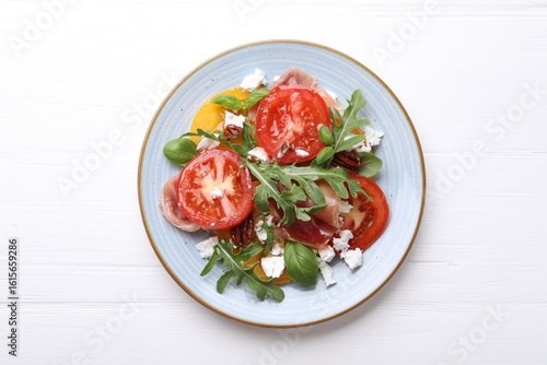 Wallpaper Mural Tasty salad with arugula, cheese, tomatoes, nuts and prosciutto on white wooden table, top view Torontodigital.ca