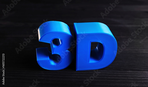 Plastic 3D Three-Dimensional Letters Printed With Home 3D Printer On A Table , Concept Of 3D Printing