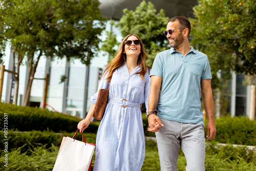 Couple strolls hand in hand...