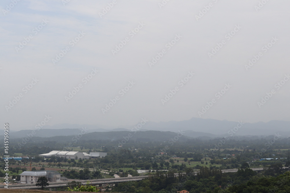 Obraz premium Vast Landscape: A panoramic vista unfolds, with layers of rolling hills and mountains stretching into the horizon, creating a sense of depth, distance, and the boundless beauty of the outdoors.