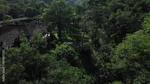 Aerial view of a mountainous and preserved region of the Atlantic Forest, a tropical rainforest in Rio de Janeiro, Brazil. The beauty and biodiversity are the highlights.