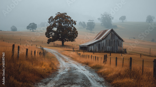Old barn in a foggy countryside