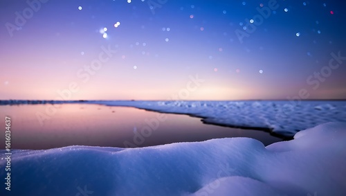 The starry night sky reflects on the icy water