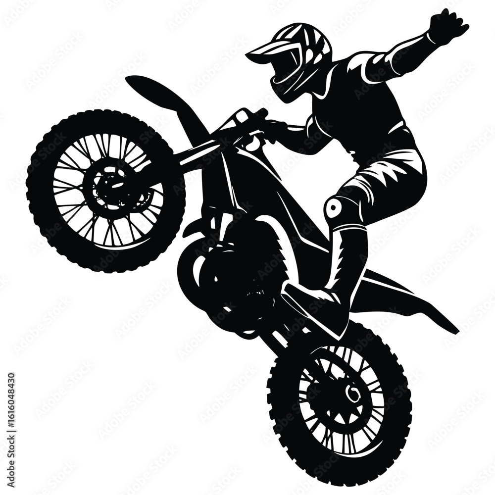 Fototapeta premium Silhouette of a skilled motocross rider performing a wheelie on a dirt bike