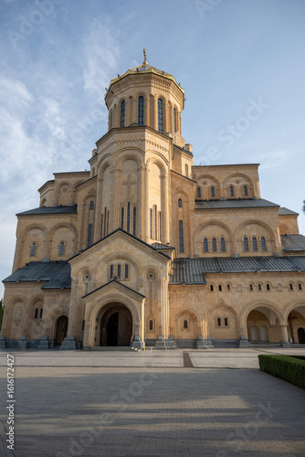 North-side of Holy Trinity Cathedral of Tbilisi which is also know as Sameba Cathedral. Its neo-Byzantine architecture features a golden dome  reflecting Georgian religious revival.