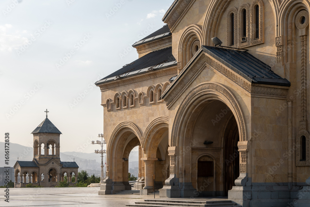 Obraz premium Bell Tower and South-side of Holy Trinity Cathedral of Tbilisi is also know as Sameba Cathedral. Its neo-Byzantine architecture features a golden dome and impressive scale.