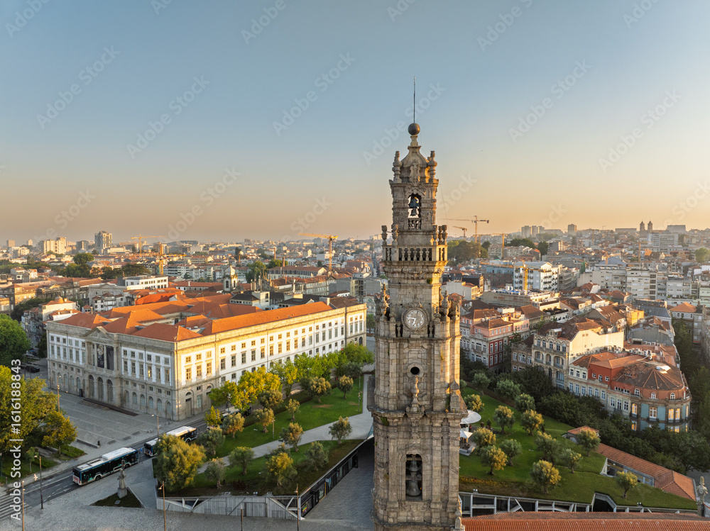 Naklejka premium Clerigos Bell Tower in Porto City, Portugal. Drone. Sunrise, Golden Hour