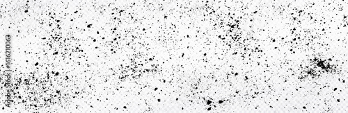 Black speckle texture isolated on white transparent background. Minimalist grunge background with scattered dots and splatters. Abstract gritty surface design.