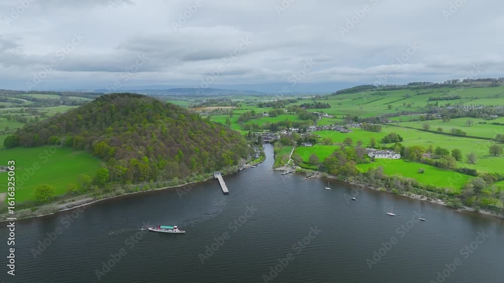 Farms and mountains over Ullswater Lake from drone, Pooley Bridge, Lake District National Park, Cumbria, England Farms and mountains over Ullswater Lake from drone, Pooley Bridge, Lake District National Park, Cumbria, England