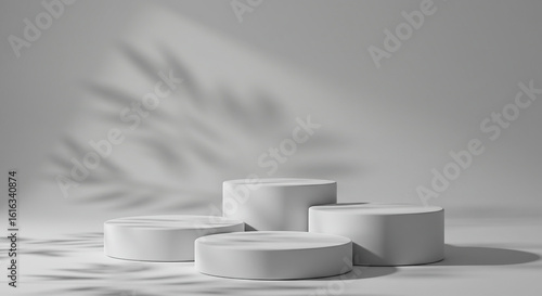 white pedestal on white background, cylindrical white pedestals are arranged in a staggered formation against a plain background