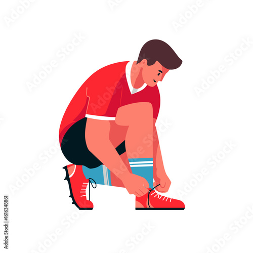A football player tying his shoelaces before a game.