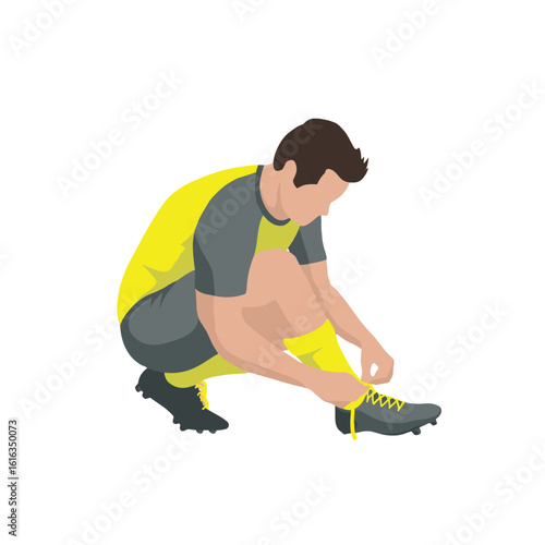 Soccer player tying his shoe laces.
