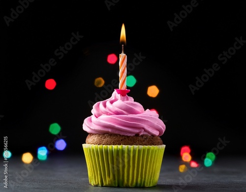 a vibrant birthday cupcake sits against a black background featuring a single lit candle on top birthday cupcake with one burning candle