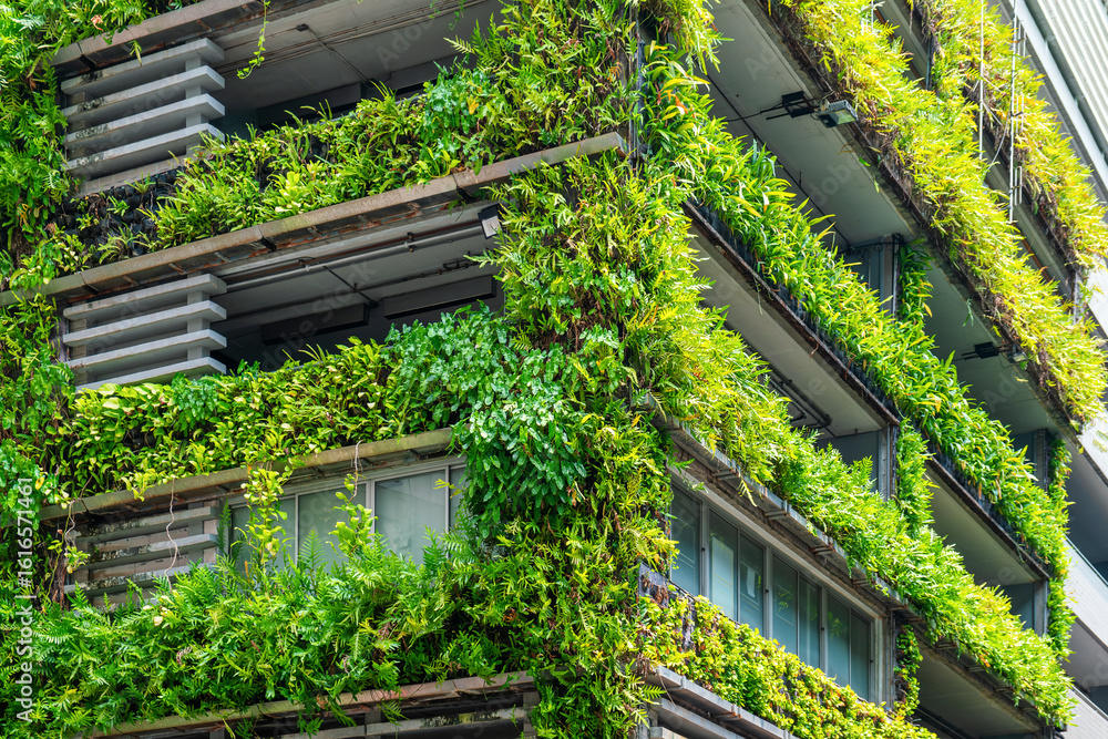 Φωτογραφία Modern building facade with lush green plants and vertical gardens promoting sustainable urban architecture in Bangkok city, Thailand
