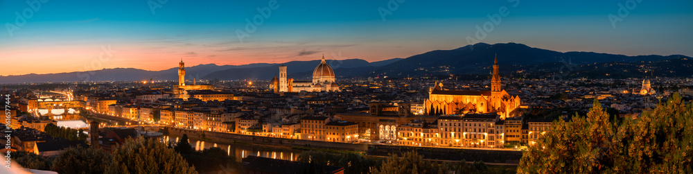 Fototapeta premium Panoramic Sunset View of Florence, Italy. The lights on the streets are lit to add contrast to the view.