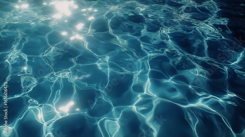 Blue Water Surface Reflecting Light in a Serene Swimming Pool on a Sunny Day.