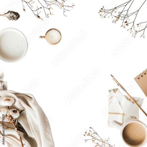 A curated flat lay of neutral tones.  Soft, muted beige and cream colored objects, including candles, a cup,  dried botanicals, and a draped cloth, arranged artfully against a black background.  