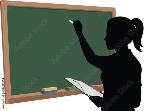 Teacher writing on blackboard in classroom silhouette
