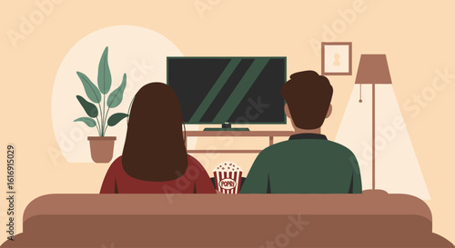 A couple seen from behind sits on a couch watching television together in their cozy living room.