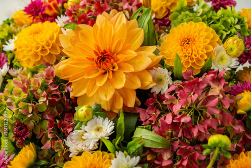 Autumn Fall Bouquet for Thanksgiving holiday. Seasonal Warm colorful blossom flowers arrangement festive decoration. Selective focus 
