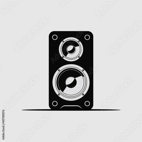 Modern black speaker with two woofers on a light gray background