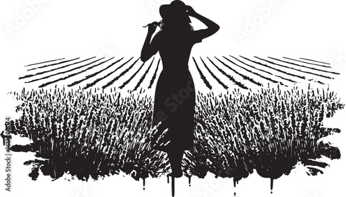 Elegant silhouette of a woman tying her hat in a field of lavend