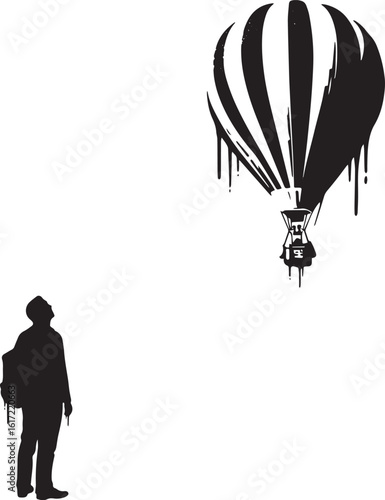 Silhouette of a man looking up at a striking hot air balloon ste