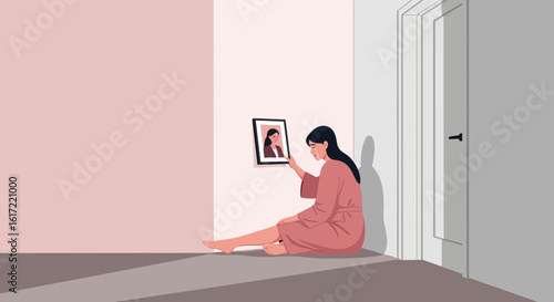 A melancholic woman sits alone, gazing at a cherished photo, evoking feelings of sadness and longing for connection amid solitude