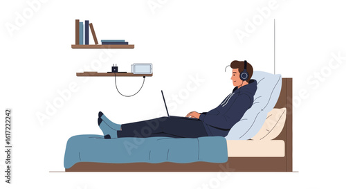 A young man relaxes in bed with a laptop while listening to music in his bedroom