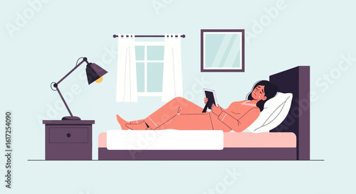 Pensive Woman Lying on Bed Holding Picture Frame in Her Bedroom at Night