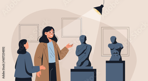 Two Women Admiring Sculptures Displayed At A Contemporary Art Gallery