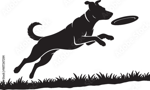 Black silhouette of a dog jumping to catch a frisbee in the grass catching playing