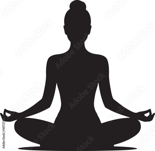 Silhouette of a woman meditating in a lotus pose yoga