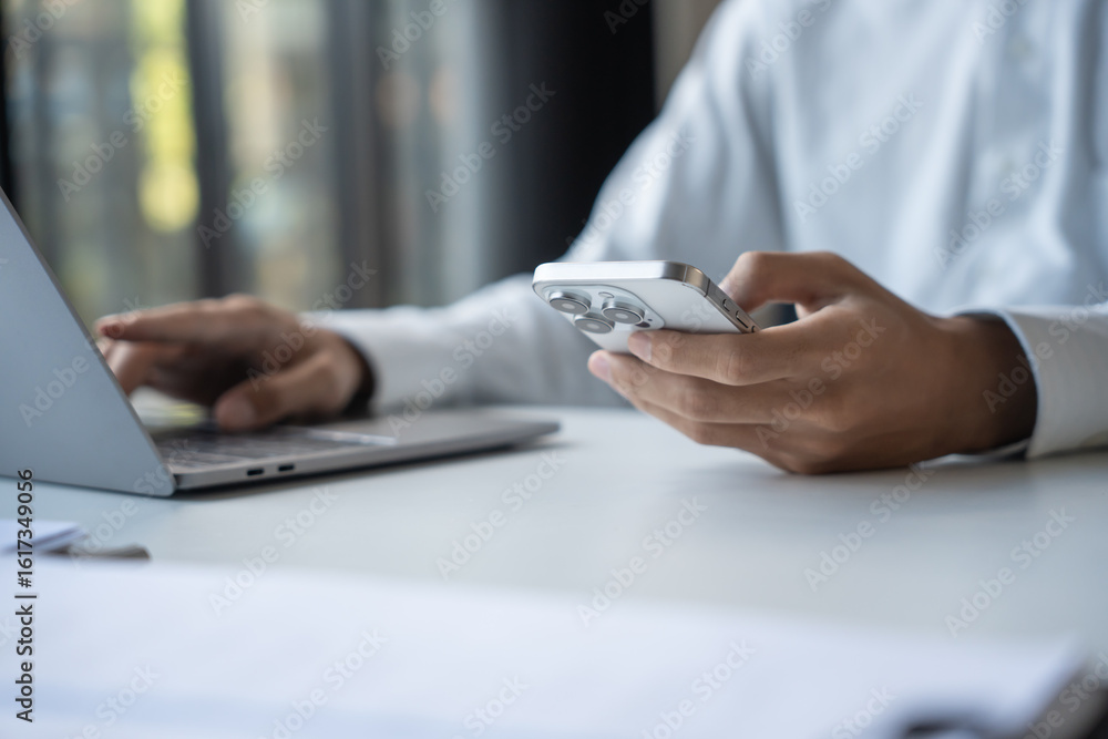 Fototapeta premium Successful Businessman Using Smartphone During Office Work