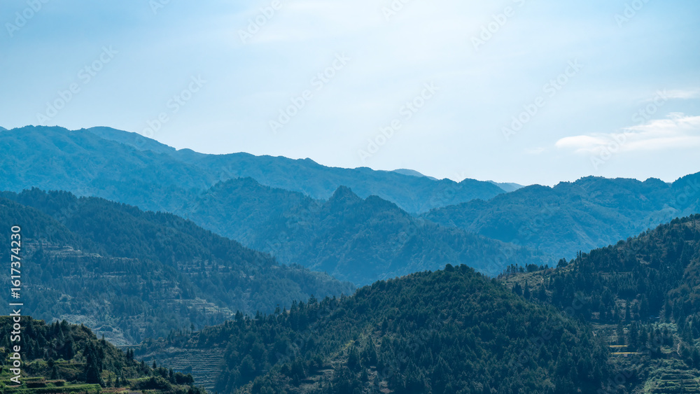 Fototapeta premium Vast Mountain Range Landscape in Soft Blue Light