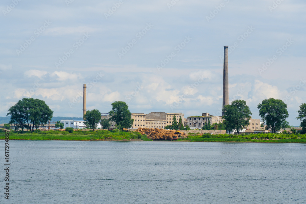 Obraz premium View of the North Korean cityscape of Sinuiju from a Yalu River cruise ship, Dandong, Liaoning, China