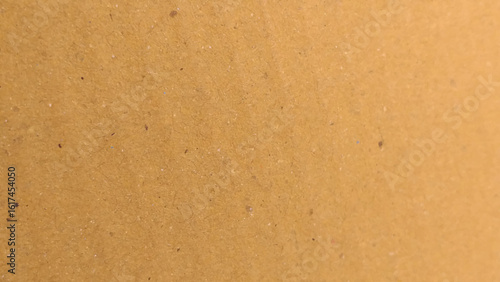 Background of brown kraft paper or cardboard texture, Abstract pattern of beige rough carton, old paper sheet, parchment or papyrus surface.