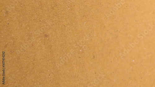 Background of brown kraft paper or cardboard texture, Abstract pattern of beige rough carton, old paper sheet, parchment or papyrus surface.
