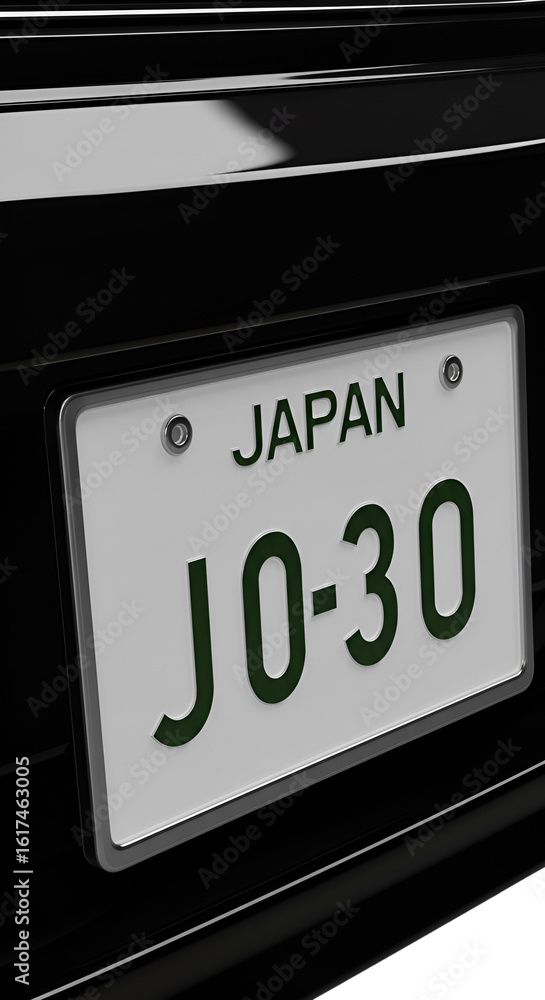 Obraz premium Close-up of a black car's rear license plate, displaying Japanese registration.