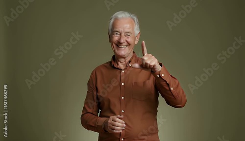 Senior Man Clapping Hands Indoors Against Solid Background Video
