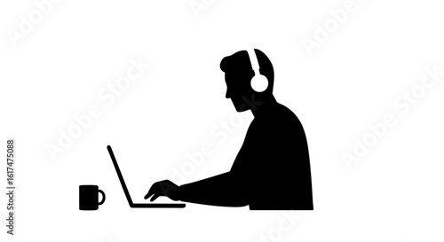 A silhouette of a person working on a laptop with headphones and a mug.