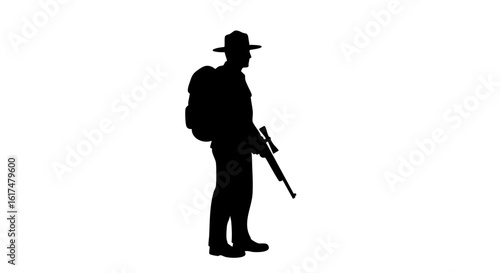 Silhouette of a person carrying a backpack and holding a rifle, with a hat on their head.