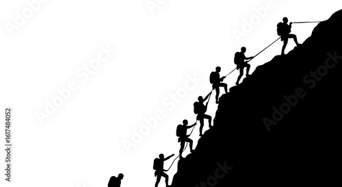 A group of climbers working towards a summit