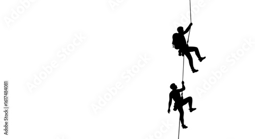 Silhouette of two climbers on a rope, ascending toward their goal.